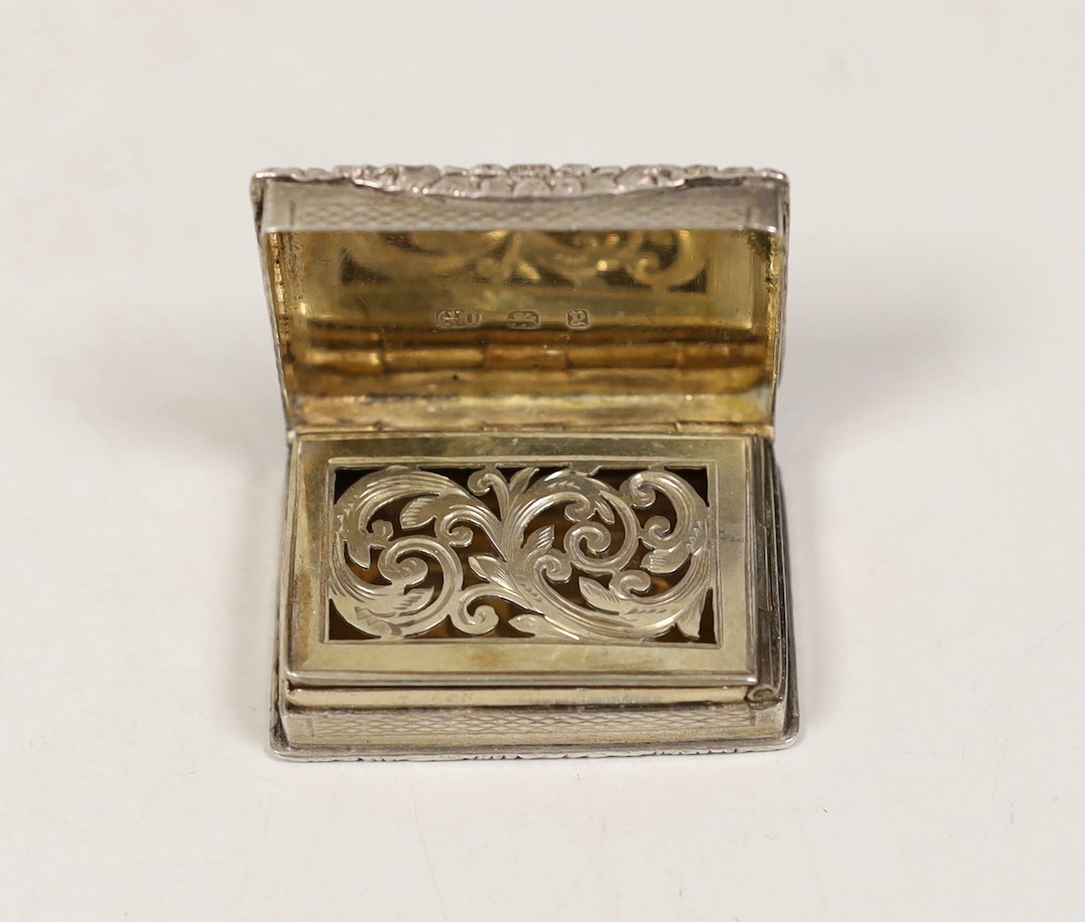 A late Victorian engine turned silver rectangular vinaigrette, George Unite, Birmingham, 1898, 41mm.